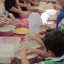 niños cocinando en Passione Italia